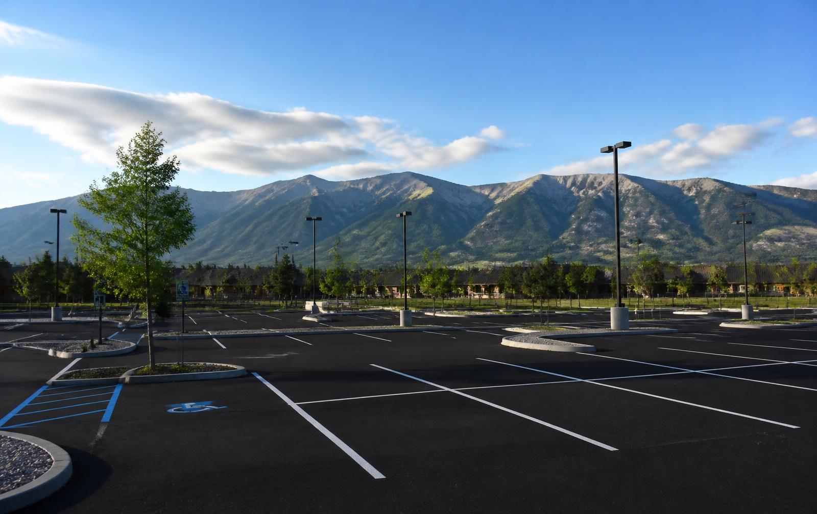 Freshly paved and striped commercial parking lot with ADA stalls near Eureka, MT