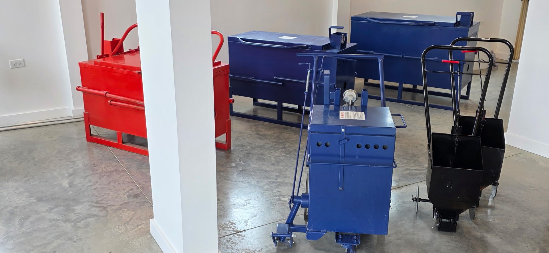 Professional crack sealing and sealcoat equipment on display