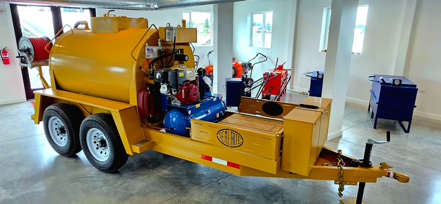 Sealcoat application rig inside the new Summit Surface Partners facility