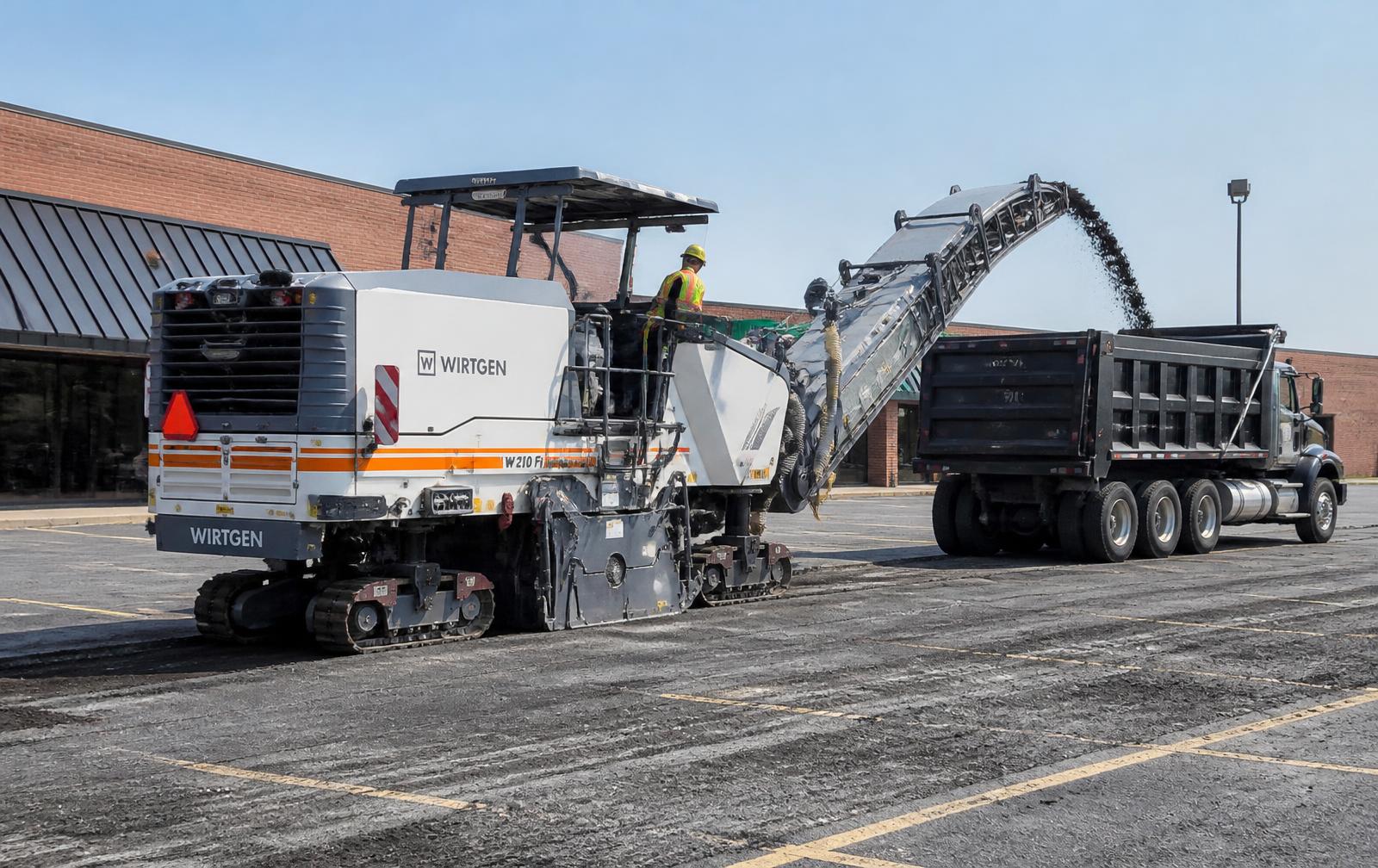 Milling machine removing failed asphalt ahead of a mill-and-overlay near Eureka, MT