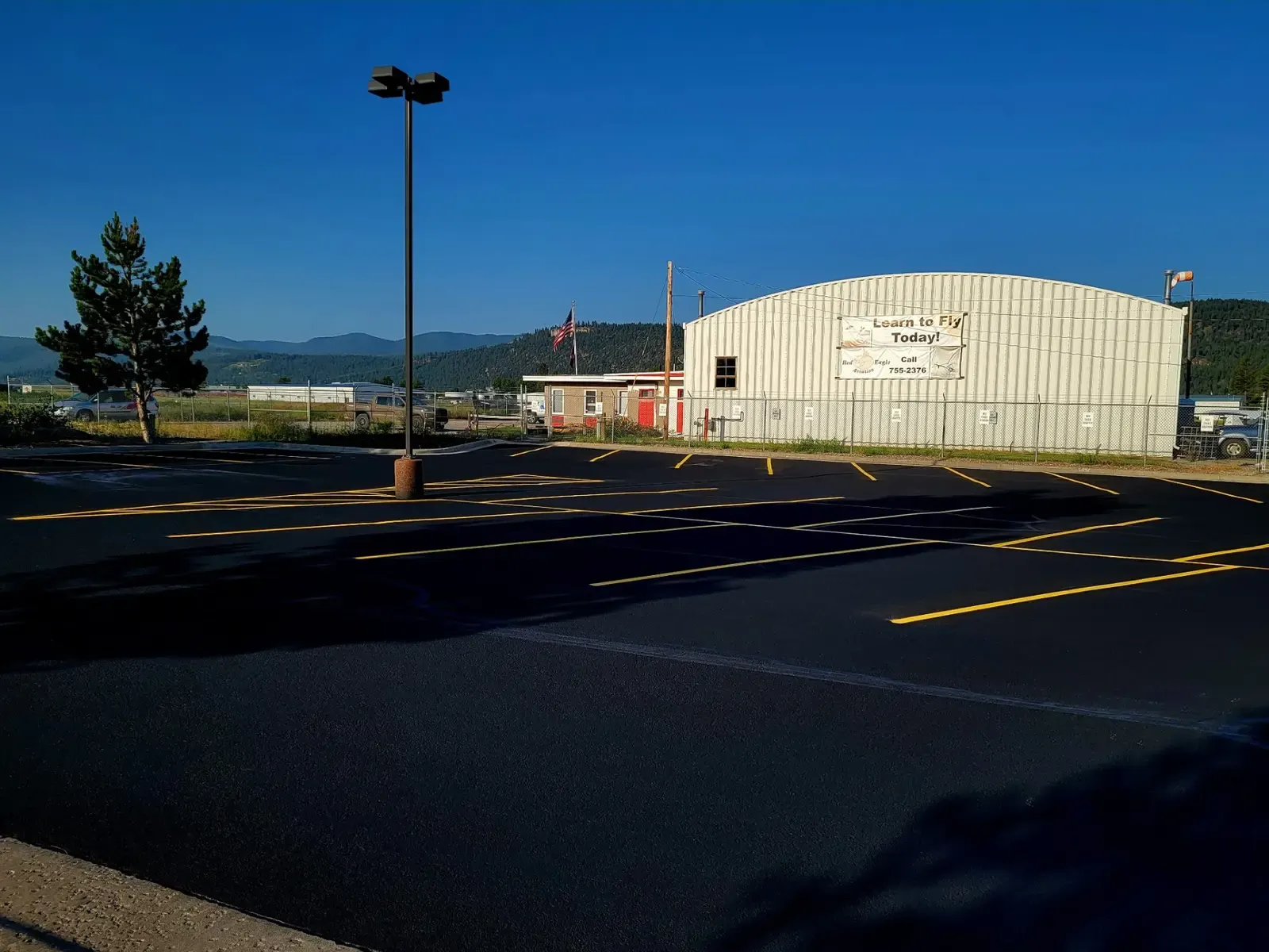 Aviation Facility Parking — Sealcoat & Striping in Kalispell, Montana by Summit Surface Partners