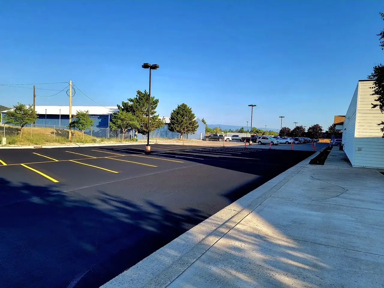 Industrial Facility Parking — Sealcoat Application in Flathead Valley, Montana by Summit Surface Partners