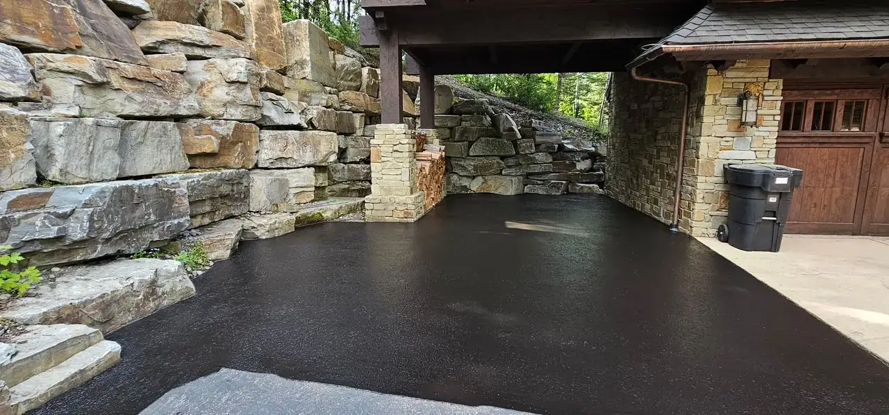 Stone Carport Sealcoating — Sealcoat Application in Montana by Summit Surface Partners