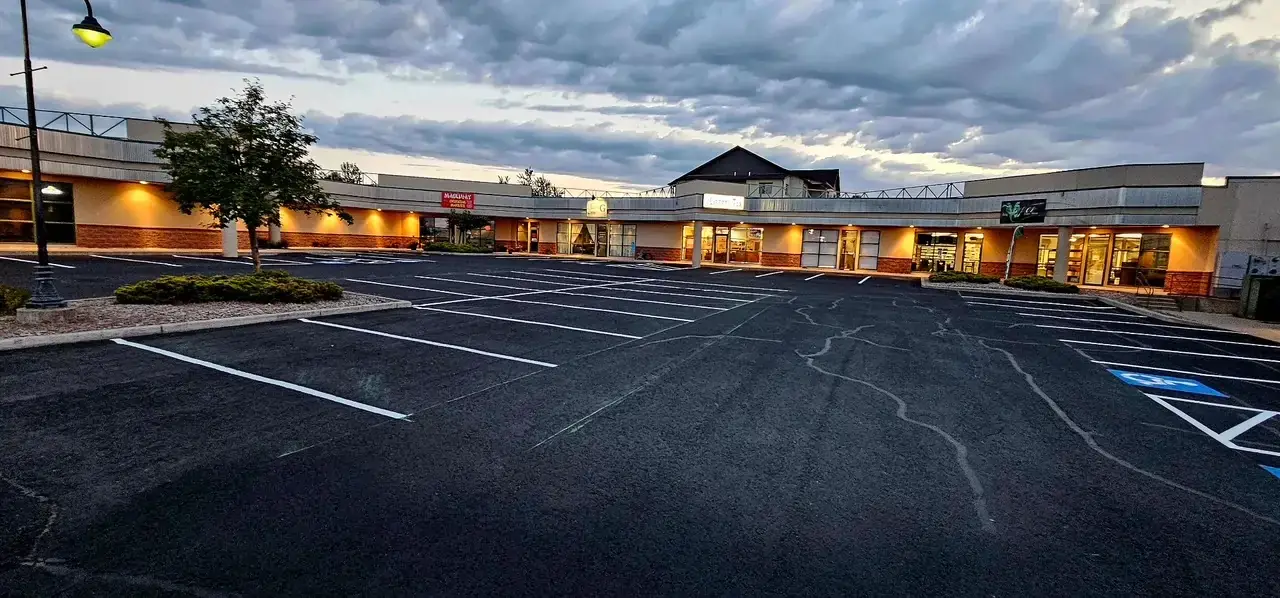 Before: Retail Center Restoration — Sealcoat & Striping project in Montana